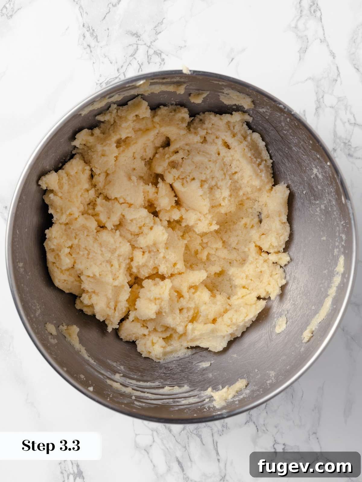 Hearty Cowboy Cookies 8 A close-up view of the butter and sugars being creamed together in a stand mixer, creating a fluffy, light, and well-aerated mixture for cookie dough.