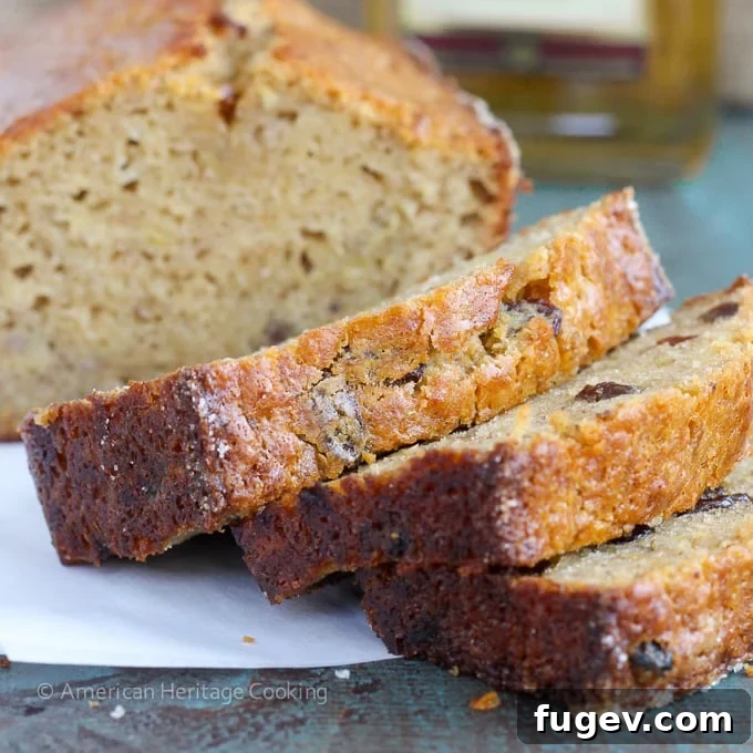 Nutty Brown Butter Rum Raisin Banana Bread 4 Whole loaf of Brown Butter Rum Raisin Banana Bread on a cooling rack, freshly baked