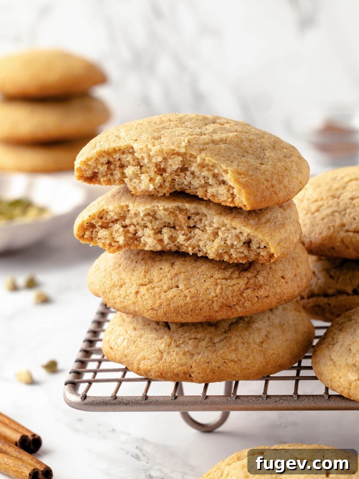 Chai-Spiced Sugar Cookies 2 A perfectly baked Chai Sugar Cookie with golden-brown edges and a soft, chewy center, dusted with a hint of sugar.