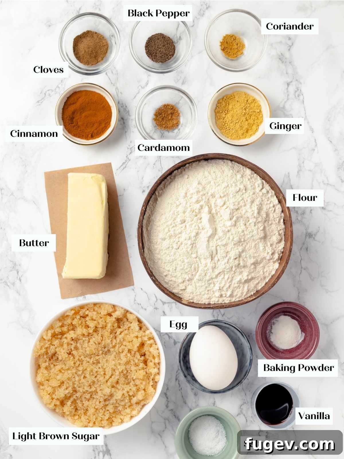 Chai-Spiced Sugar Cookies 4 A selection of the key spices and ingredients for making Chai Sugar Cookies, laid out on a surface.