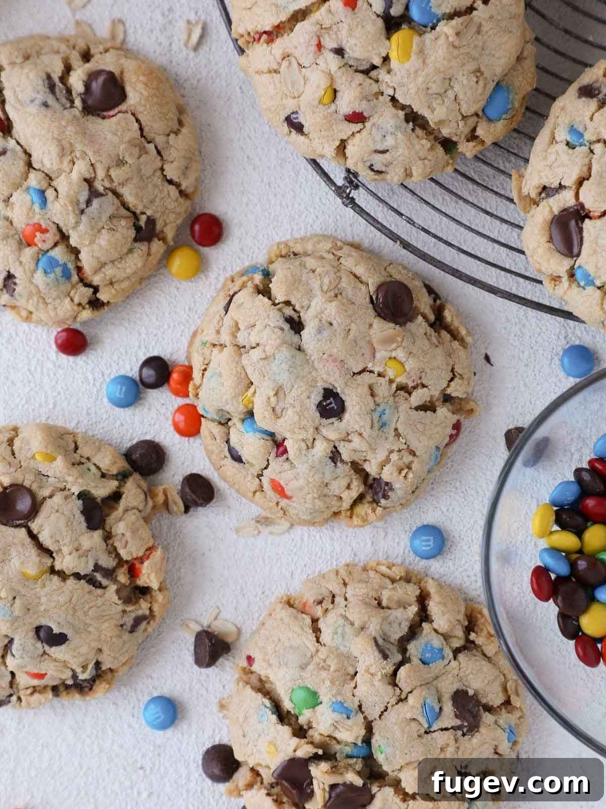 Ultimate Monster Cookies 11 Fully baked monster cookies with colorful M&Ms peeking through the golden brown surface.