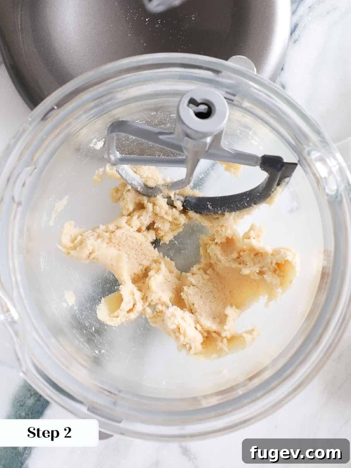 Ultimate Monster Cookies 6 Butter and sugars creamed together in a mixing bowl to form a smooth base for monster cookie dough.