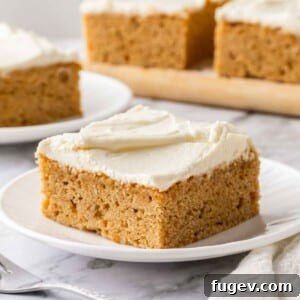 Luscious Banana Cake with Tangy Cream Cheese Frosting 13 A close-up of cream cheese frosting swirled beautifully over the top of a banana cake.