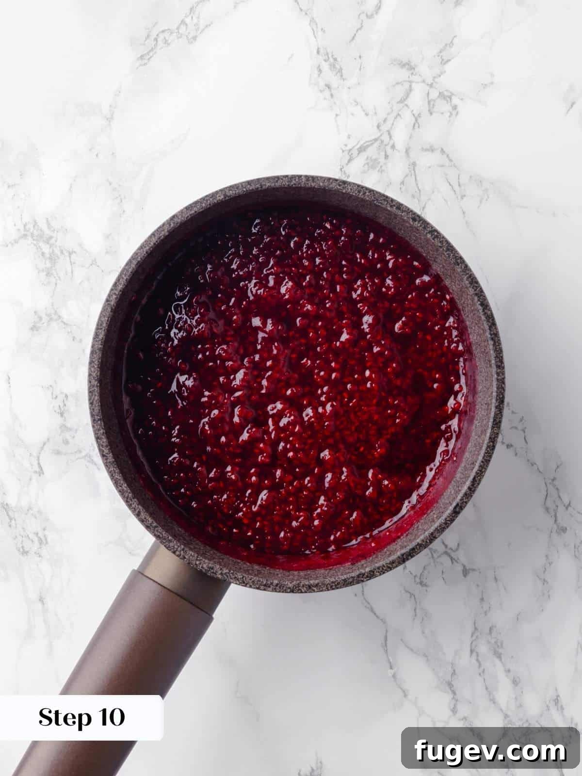 Decadent Chocolate Raspberry Indulgence 14 Fresh raspberries simmering in a saucepan with lemon juice and sugar, releasing their juices to create a smooth and flavorful jam.