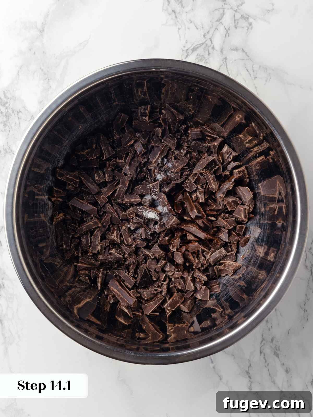 Decadent Chocolate Raspberry Indulgence 17 A mixing bowl with finely chopped dark chocolate, vanilla extract, and salt, ready to receive the hot cream for ganache.