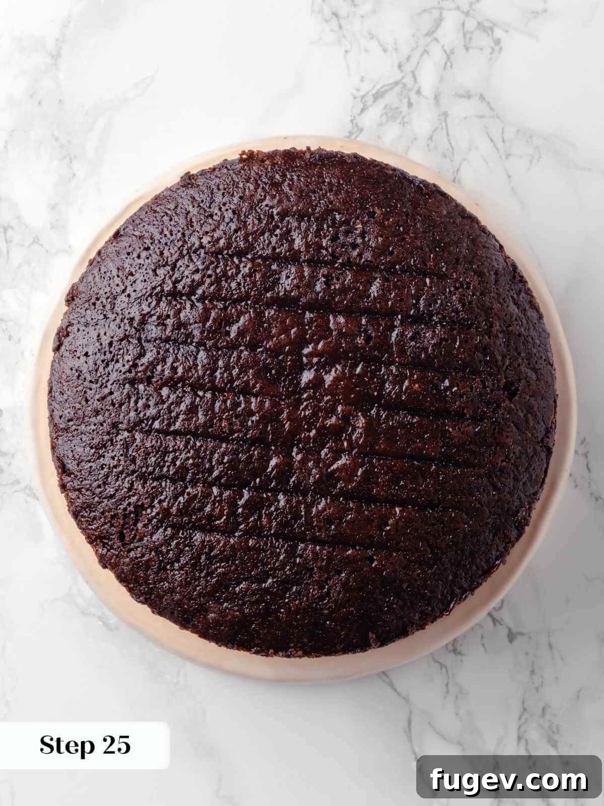 Decadent Chocolate Raspberry Indulgence 26 The second layer of the chocolate raspberry cake carefully placed on top of the first filled layer, ready for its own layer of frosting.