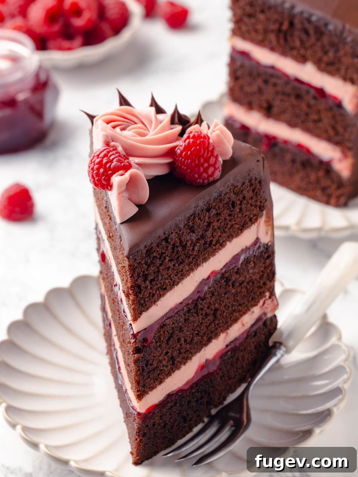 Decadent Chocolate Raspberry Indulgence 29 A delectable slice of chocolate raspberry cake served on a elegant white plate, beautifully garnished with fresh, ripe raspberries.