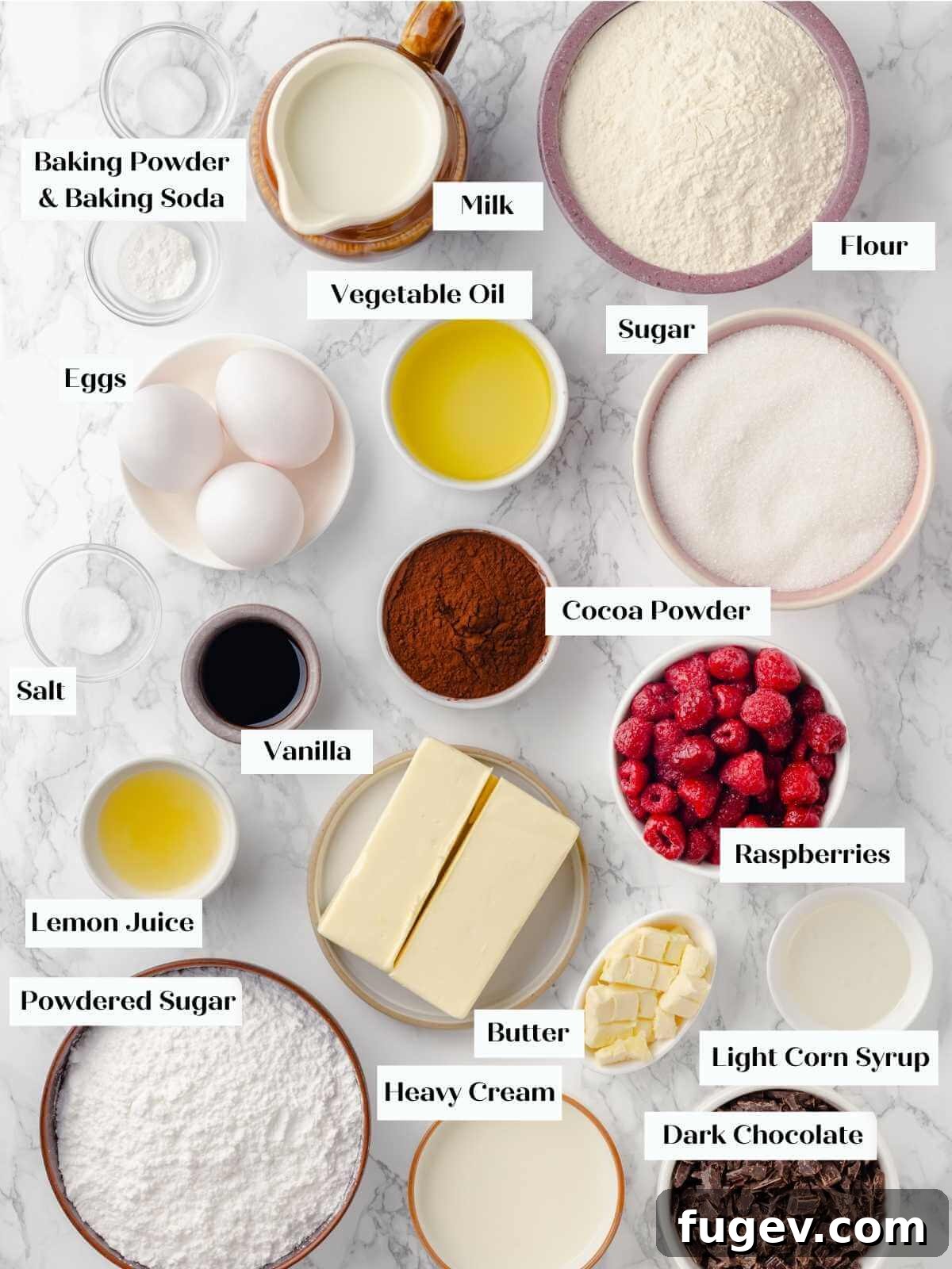 Decadent Chocolate Raspberry Indulgence 4 A flat lay of all the chocolate raspberry cake ingredients carefully arranged on a pristine white marble surface, including cocoa powder, flour, eggs, raspberries, butter, and chocolate.