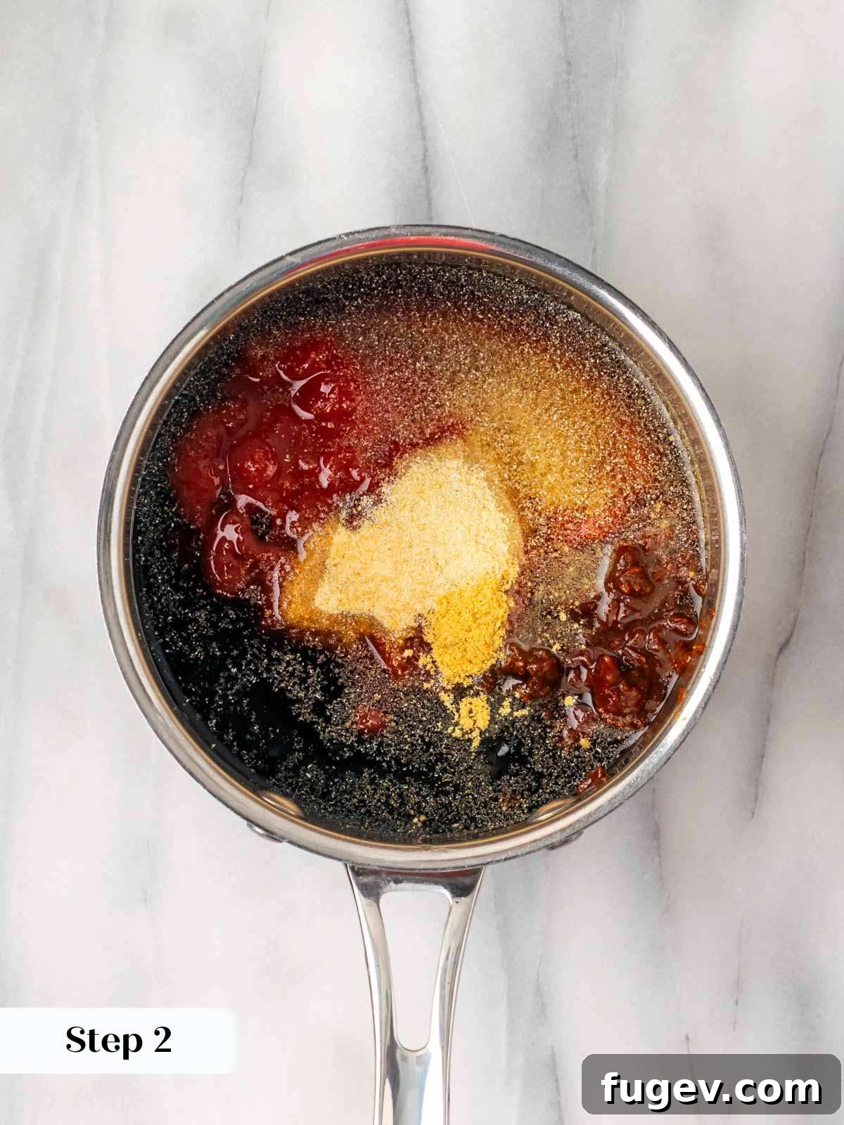 Tender Oven-Baked BBQ Chicken Breast 7 Chipotle bbq sauce ingredients being mixed in a small pot.