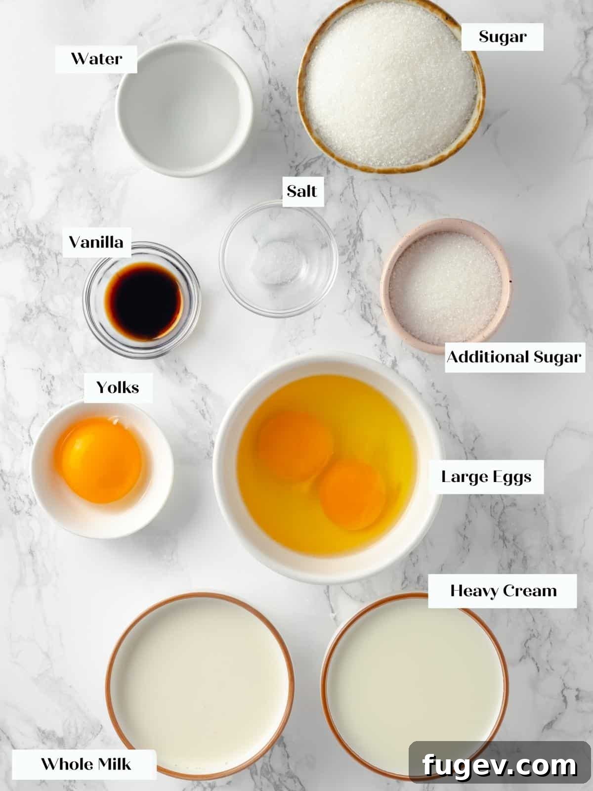 Silky Caramel Custard 3 Ingredients for creme caramel, including sugar, eggs, milk, and vanilla bean paste, neatly arranged on a white countertop, ready for preparation.