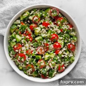 Wholesome Barley Tabbouleh 7 A large, inviting bowl of Pearl Barley Tabbouleh Salad, showcasing its vibrant colors and textures.