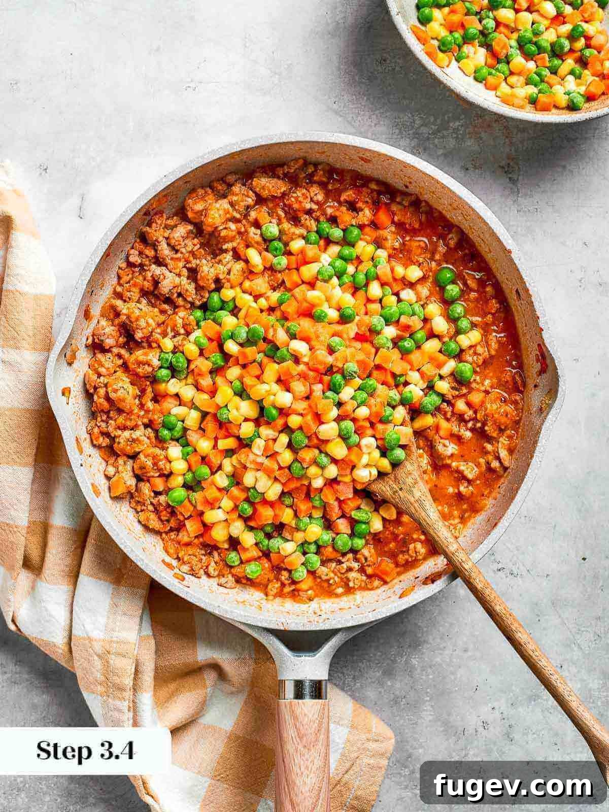 Golden Chicken Potato Bake 13 Colorful frozen vegetables added to a skillet, bringing texture and flavor to the dish.