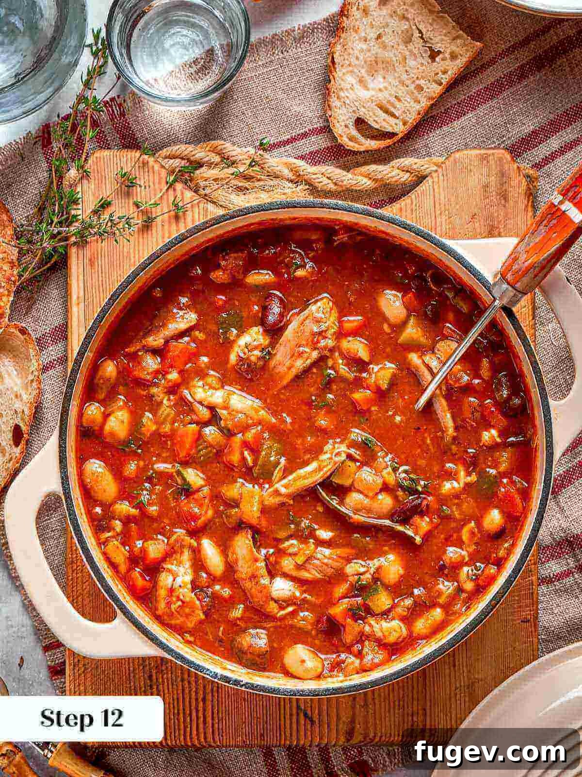 Nourishing Chicken Vegetable Medley 16 A fully cooked, rich and thick chicken vegetable soup simmering in a Dutch oven.