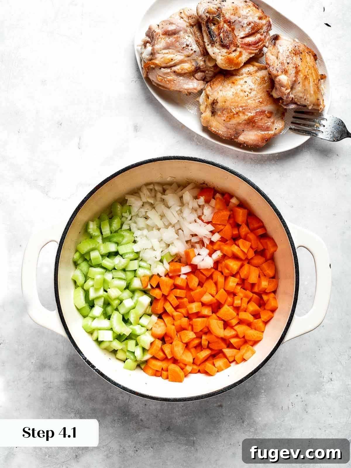Nourishing Chicken Vegetable Medley 7 Freshly chopped carrots, onions, and celery added to the hot pot for the soup base.