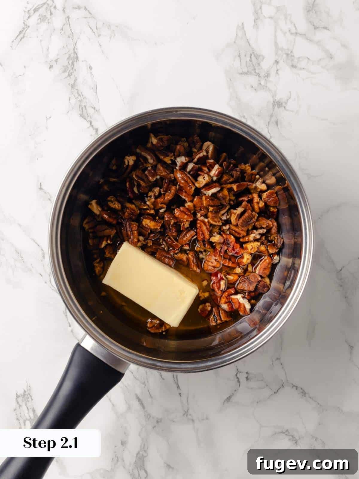 Gooey Pecan Caramel Rolls 6 A pot with butter, brown sugar, and pecans melting together.