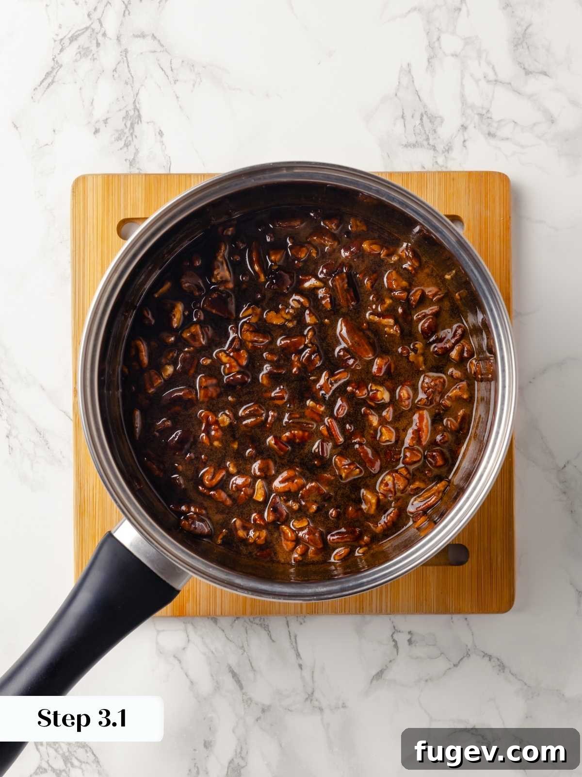 Gooey Pecan Caramel Rolls 7 A saucepan with melted brown sugar and butter for caramel.