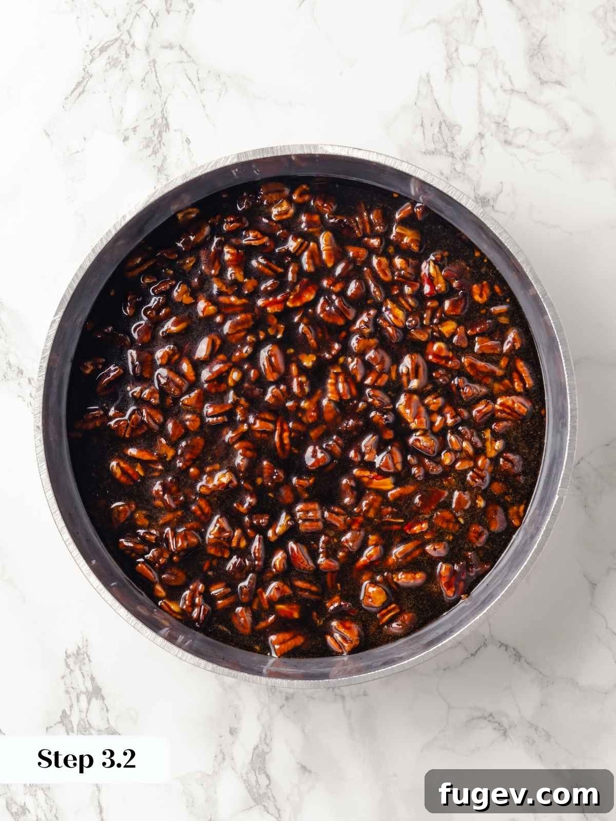 Gooey Pecan Caramel Rolls 8 A pan filled with pecans and caramel mixture before baking.