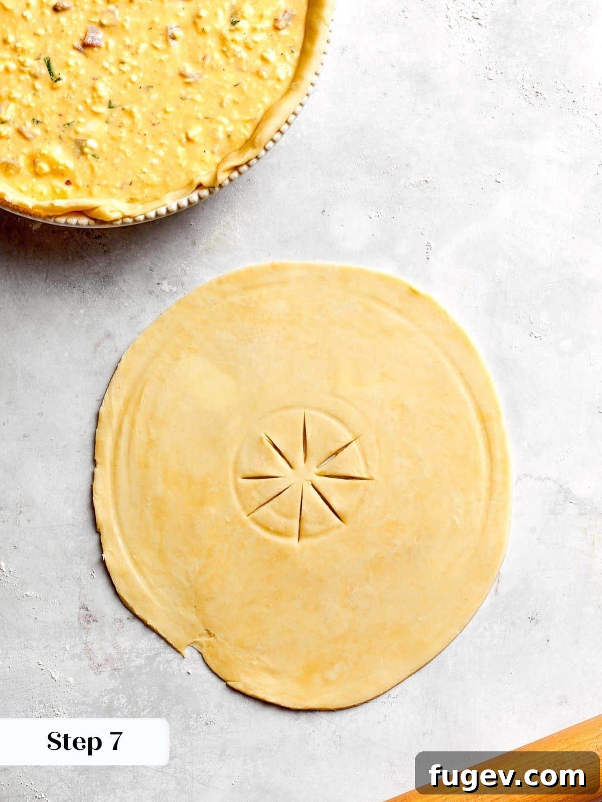 Rustic Italian Easter Pie 13 A top pie crust for pizza rustica, expertly scored with slits to allow steam to escape during the baking process.