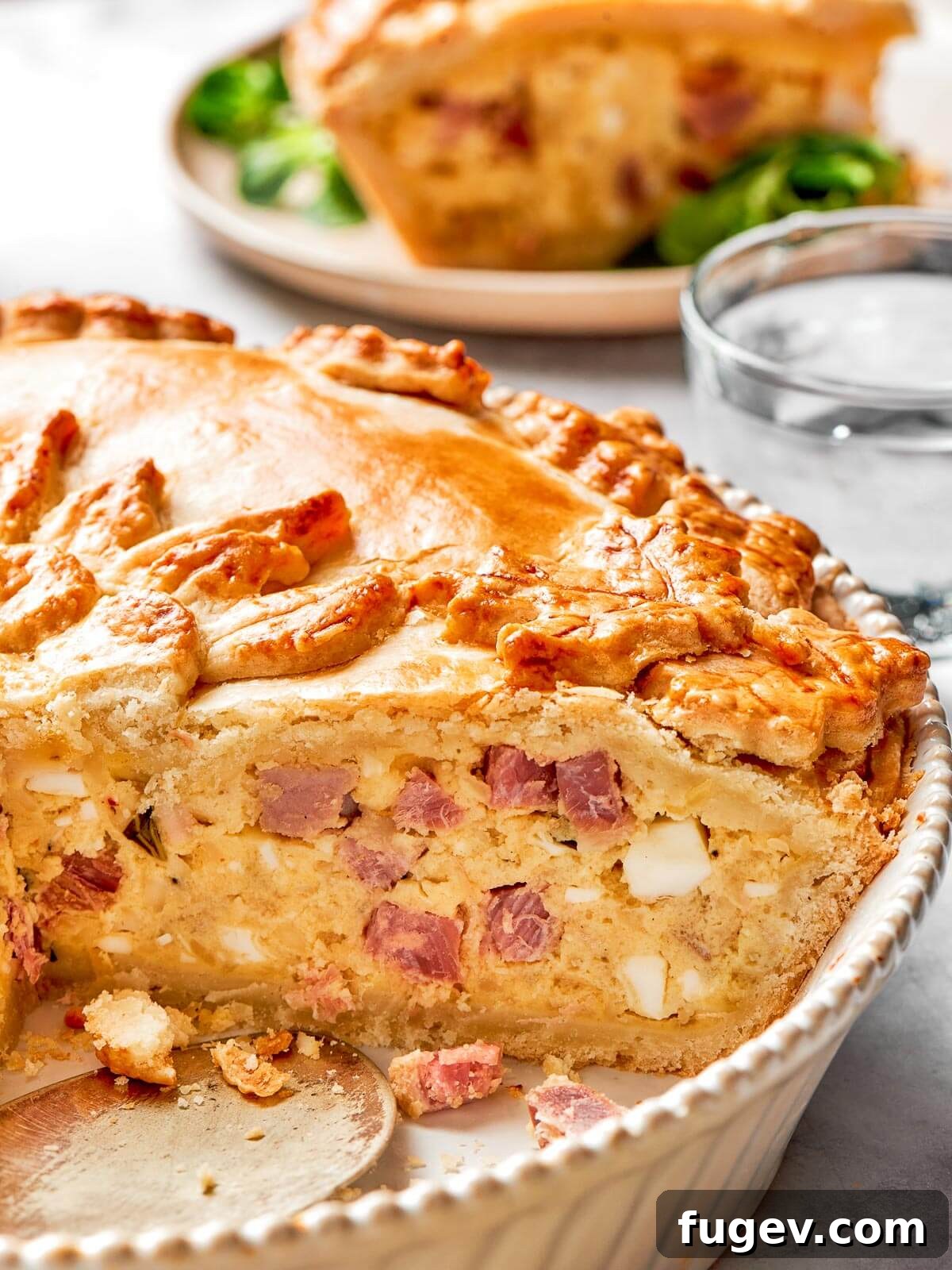 Rustic Italian Easter Pie 15 A close-up view of the savory pizza rustica filling, showing generous slices of soppressata and salami embedded within the creamy, cheesy ricotta mixture.