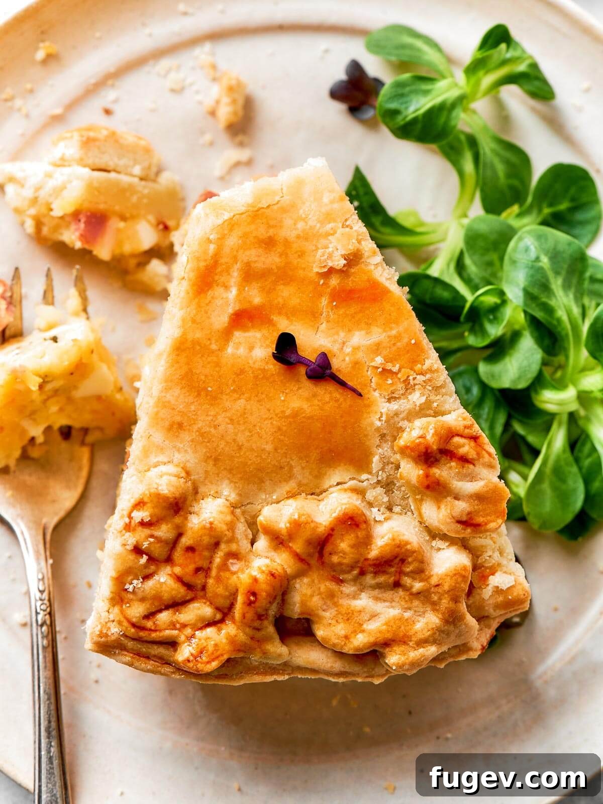 Rustic Italian Easter Pie 16 An elegantly baked pizza rustica, showcasing its intricate decorative pastry top and golden-brown perfection, ready to be sliced.