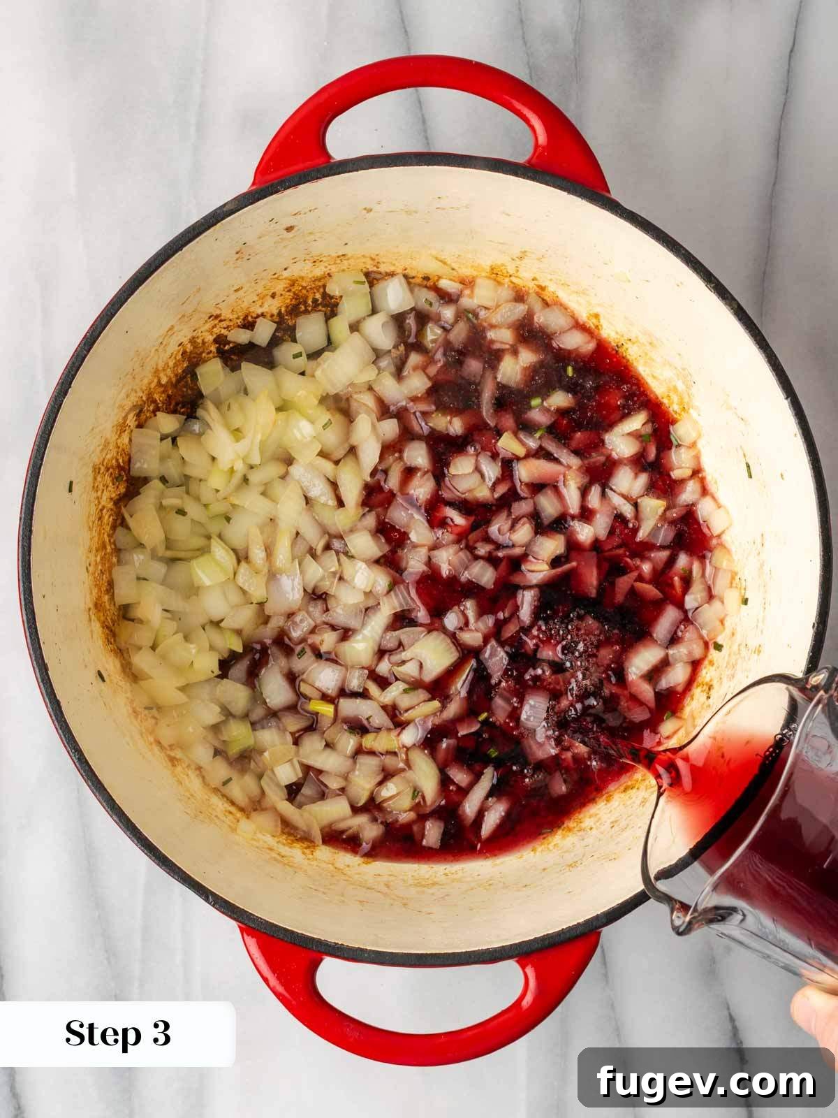 Hearty Steak Chili 7 Adding red wine to the chili pot after sautéing aromatics.