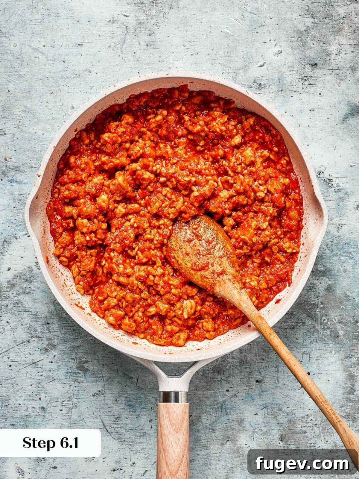 Homestyle Turkey Sloppy Joes 9 The sloppy joe mixture simmering gently on the stovetop, bubbling and thickening.