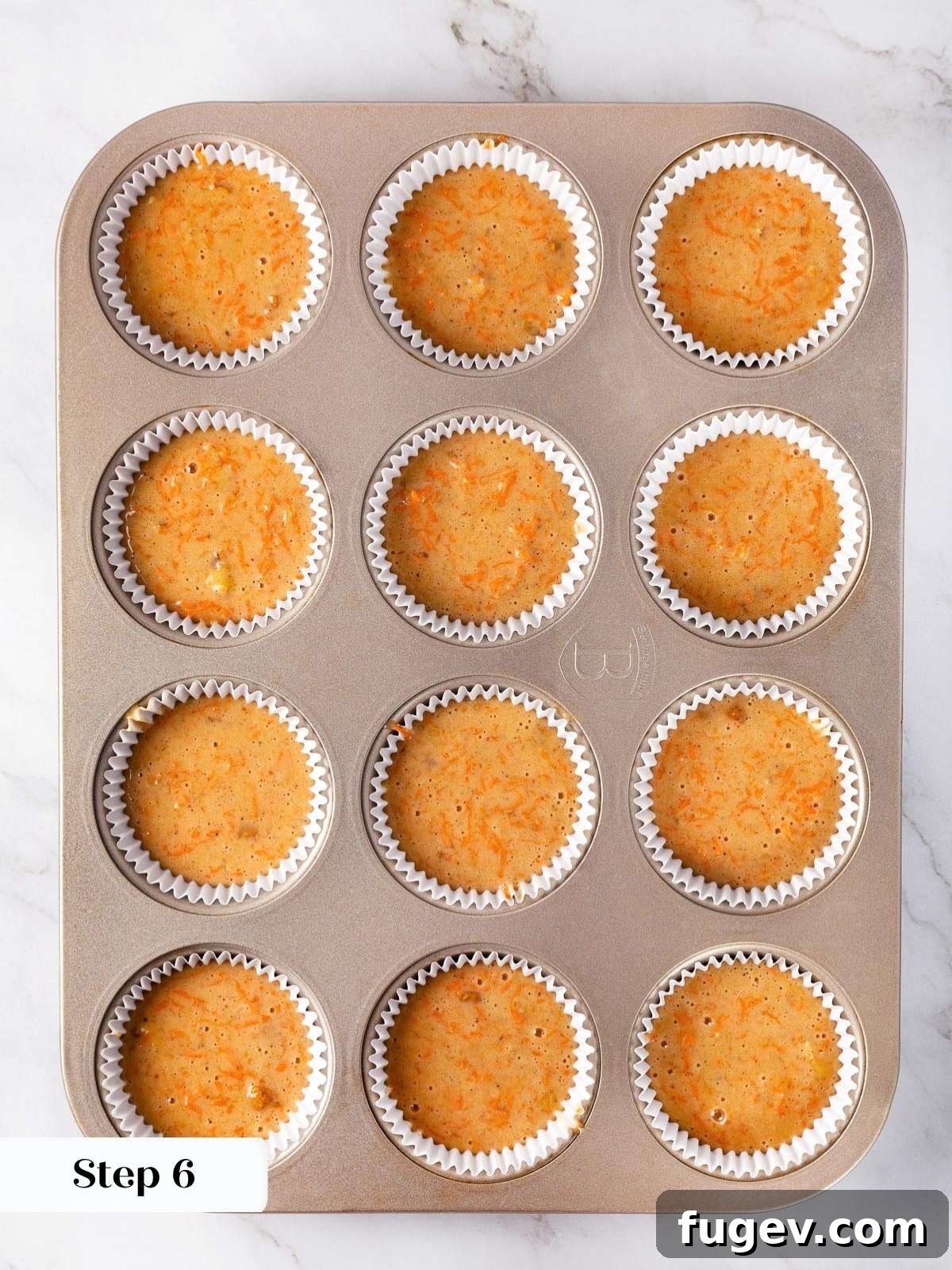 Decadent Carrot Cake Cupcakes 14 Creaming cream cheese and butter until fluffy.