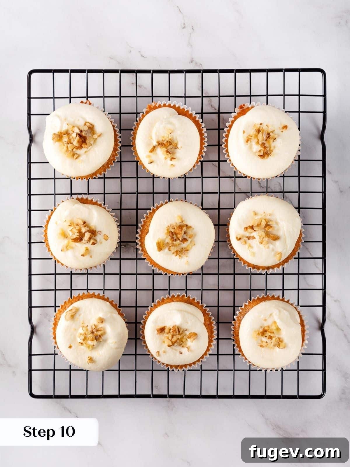 Decadent Carrot Cake Cupcakes 18 A set of carrot cupcakes after being frosted and ready to serve.