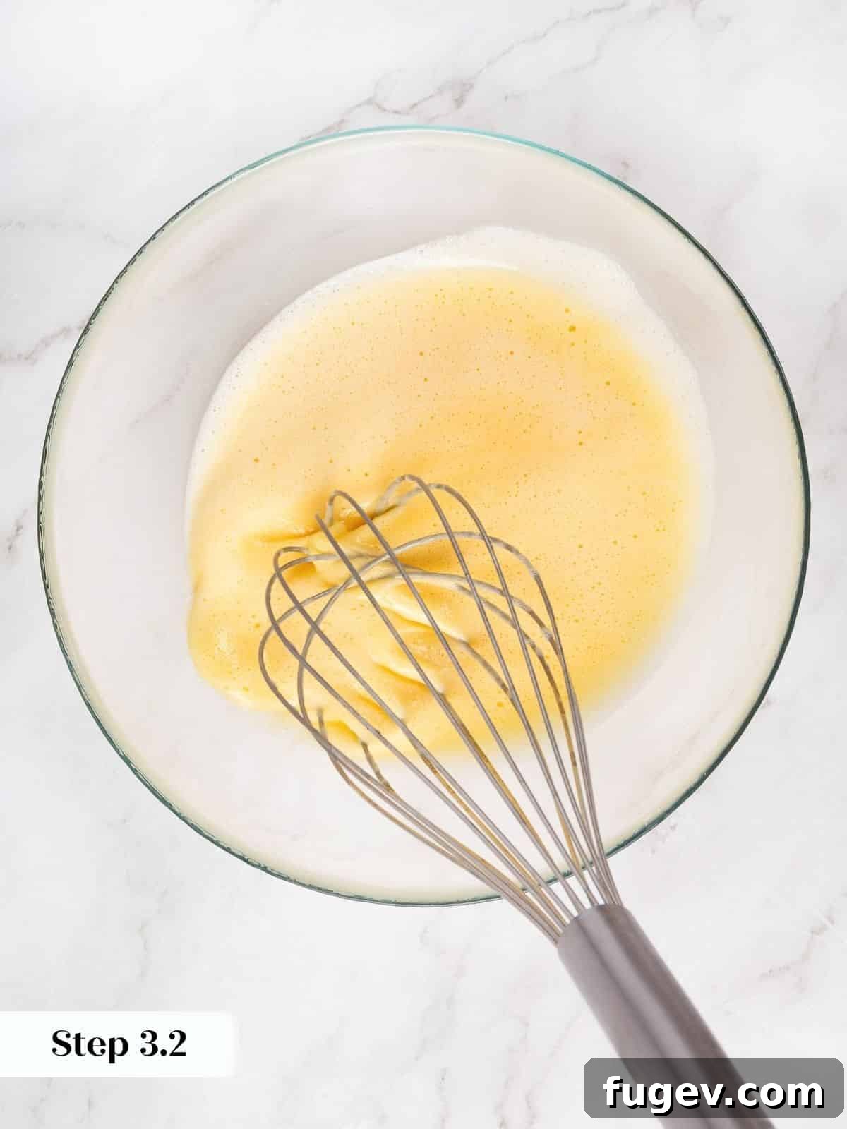 Decadent Carrot Cake Cupcakes 8 Slowly drizzling oil into the beaten eggs for emulsification.