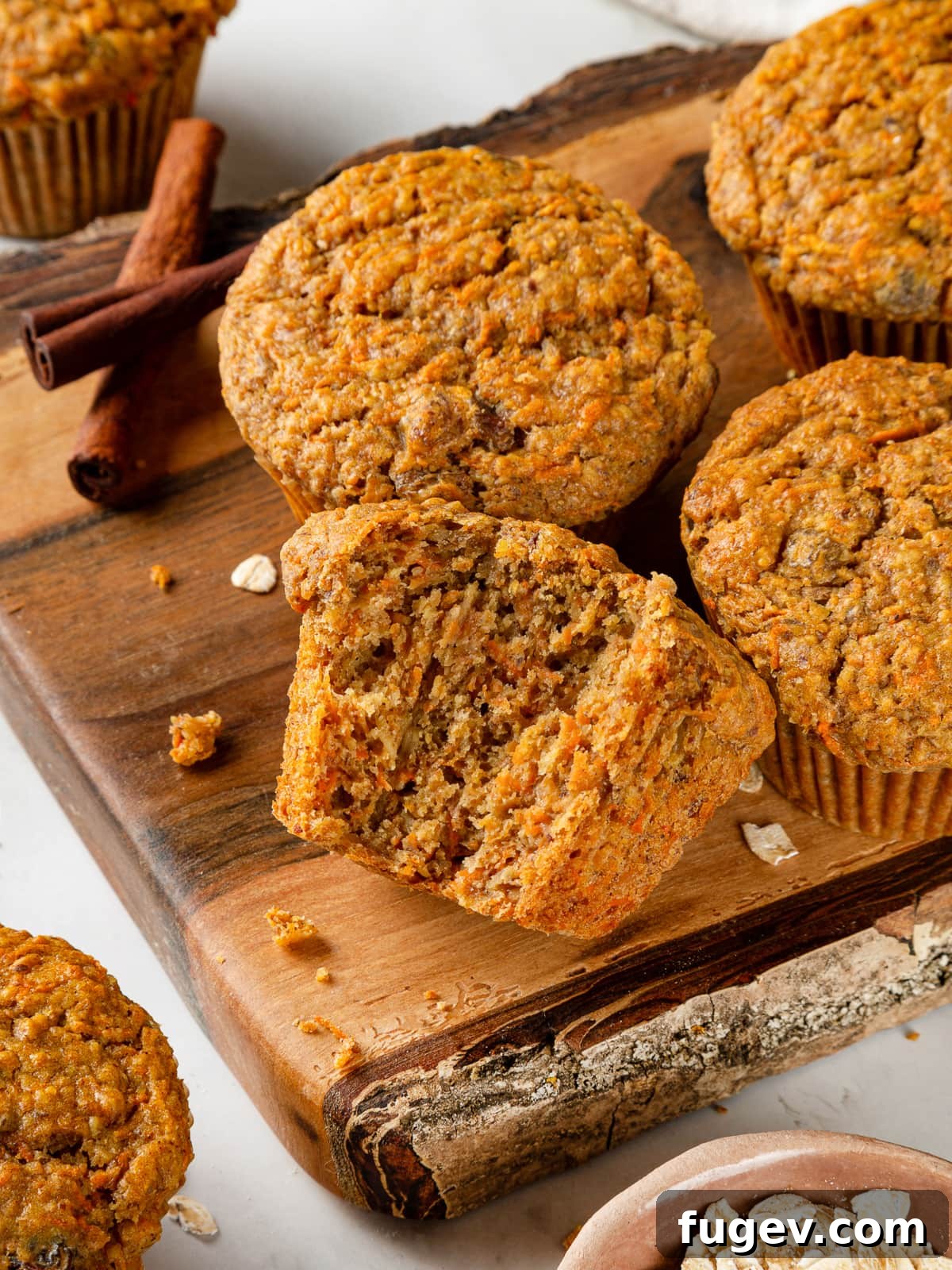 Wholesome Carrot Muffins 13 An inside view of a healthy carrot muffin, showcasing its soft, tender crumb and moist texture, rich with carrot pieces.