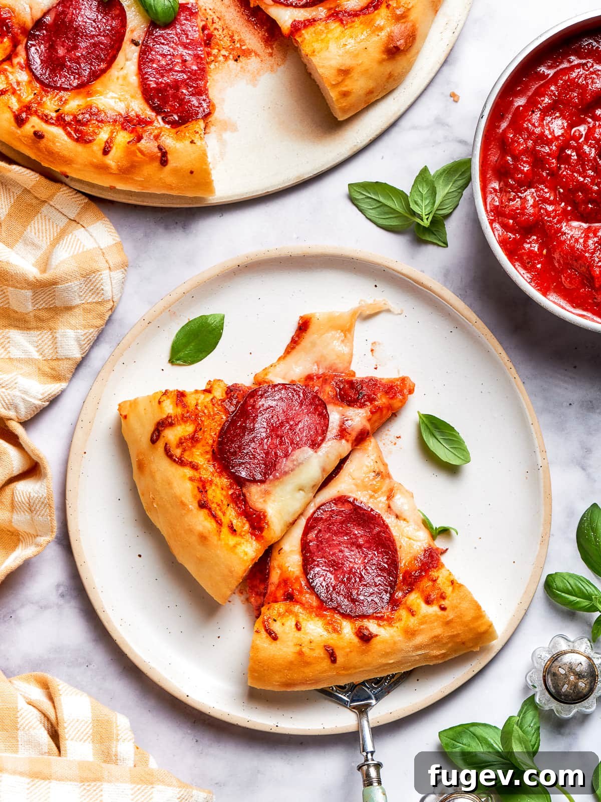 Zesty Pepperoni Delight 11 A pair of pizza slices with melted cheese and crispy crusts.