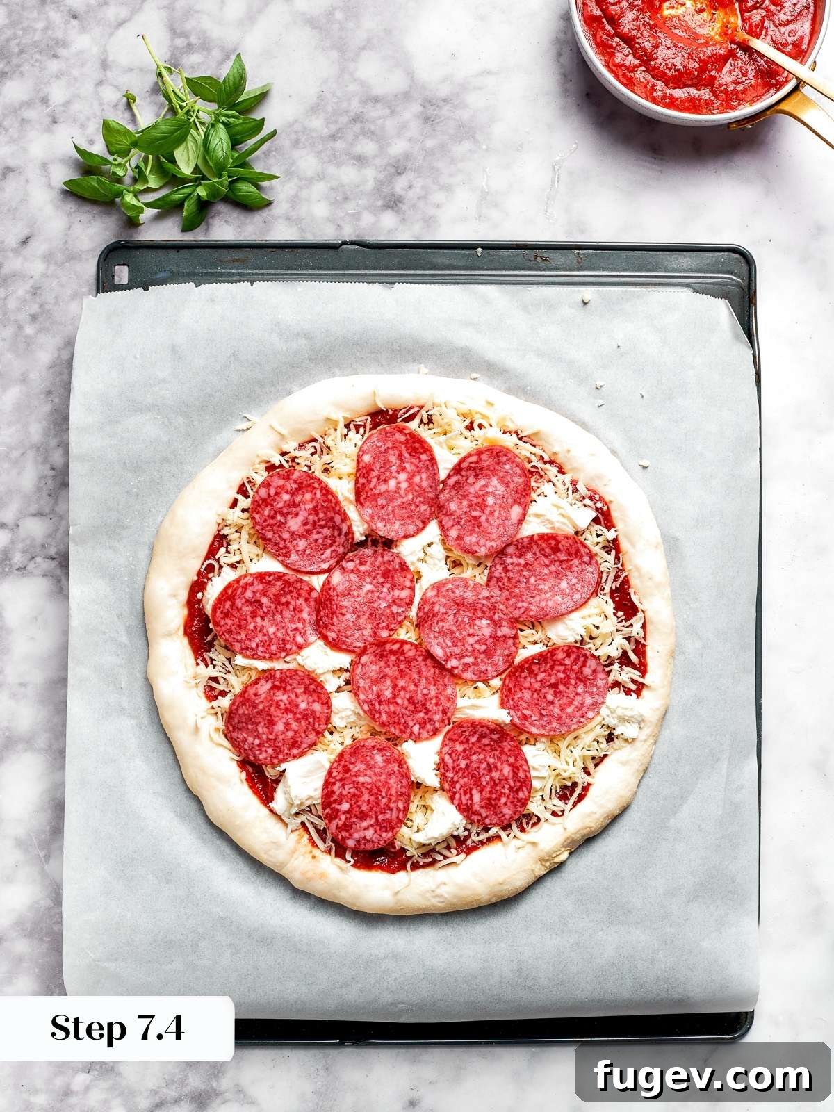 Zesty Pepperoni Delight 9 Arranging pepperoni slices on top of the cheese layer.