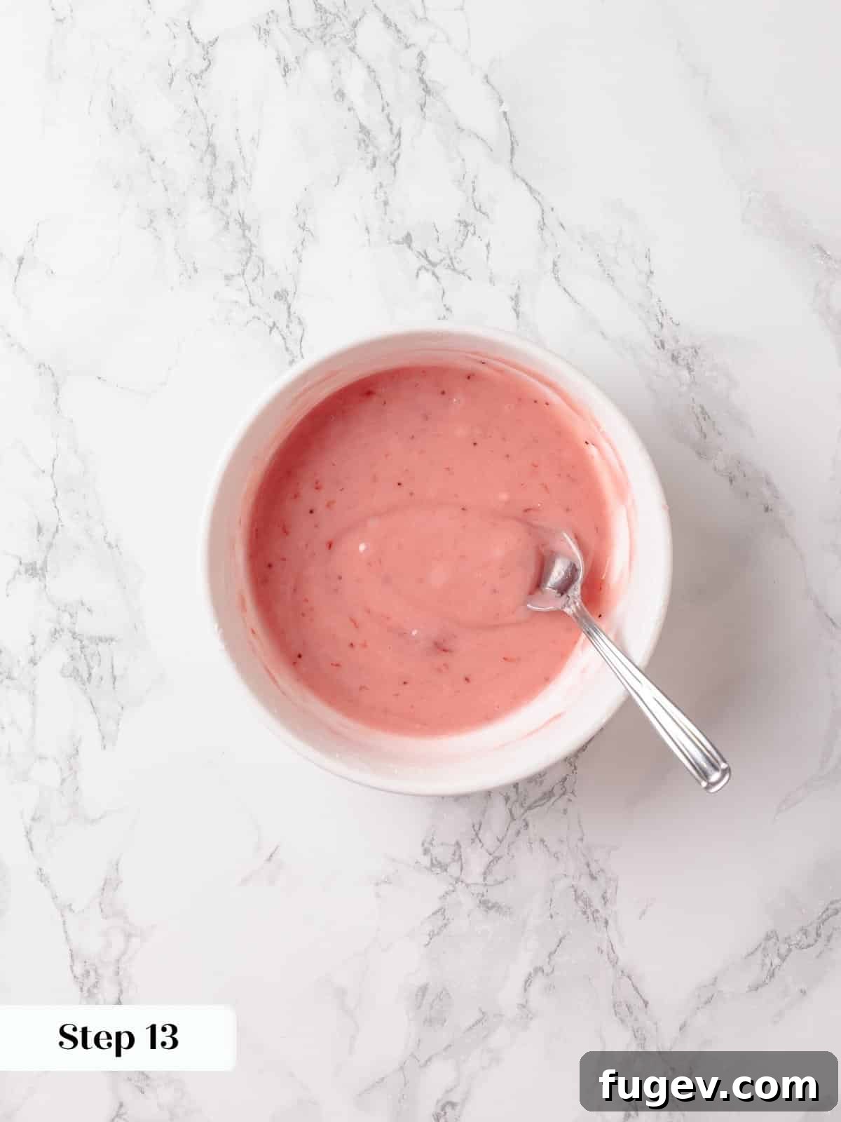 Strawberry Bliss Pound Cake 18 A silky, smooth pink glaze, expertly made from strawberry jam and powdered sugar, whisked to the perfect pourable consistency.