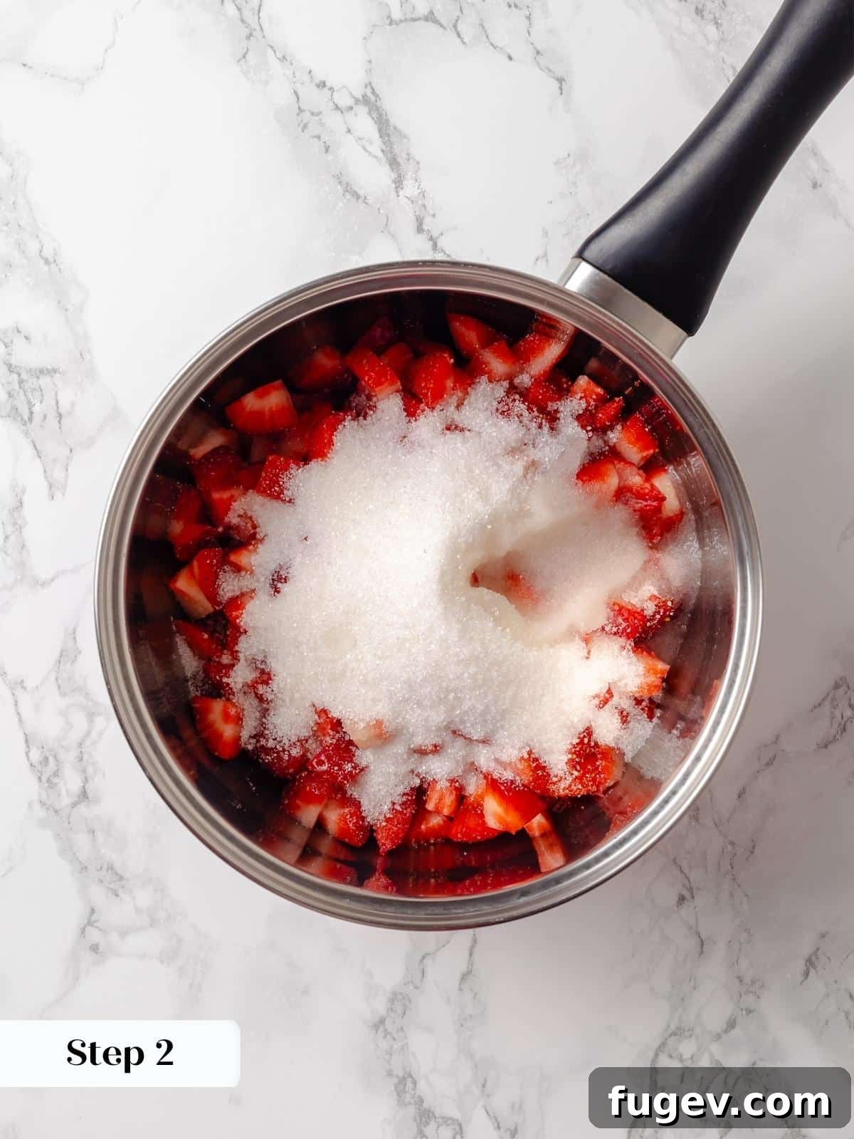 Strawberry Bliss Pound Cake 5 Freshly diced strawberries, granulated sugar, and bright lemon juice combined in a saucepan, ready to be cooked into a vibrant jam.