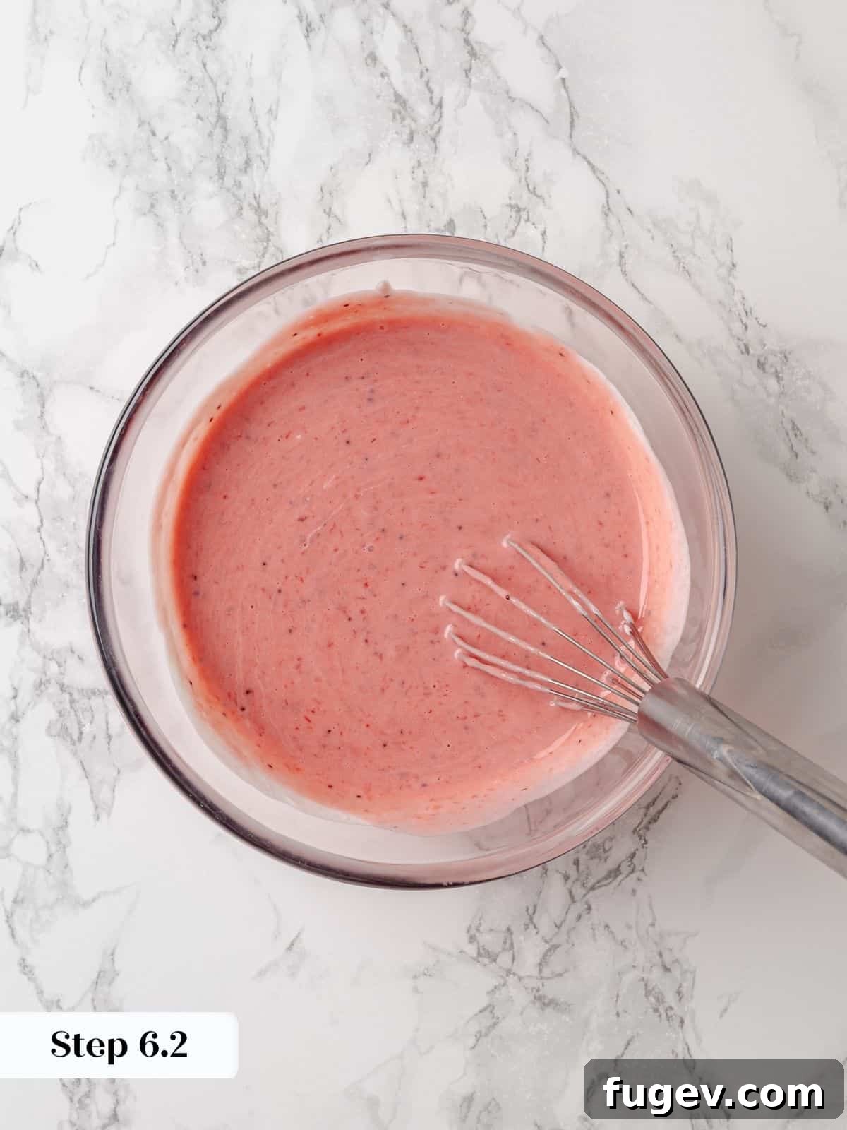 Strawberry Bliss Pound Cake 10 The smooth, light pink mixture of sour cream and strawberry jam, perfectly blended and ready to be incorporated into the cake batter.