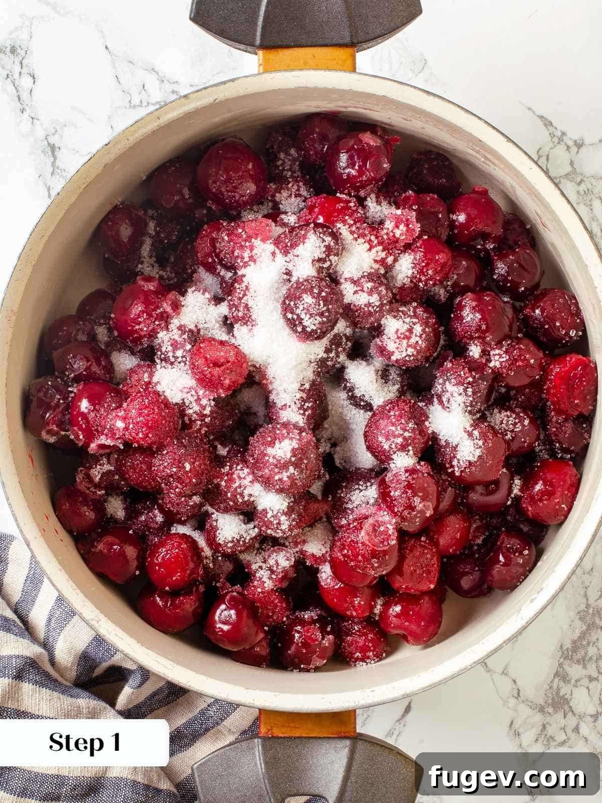 Homemade Cherry Pie Filling Perfection 5 Cherries, sugar, and extract combined in a saucepan before thickening for pie filling, showing initial stage of cooking.