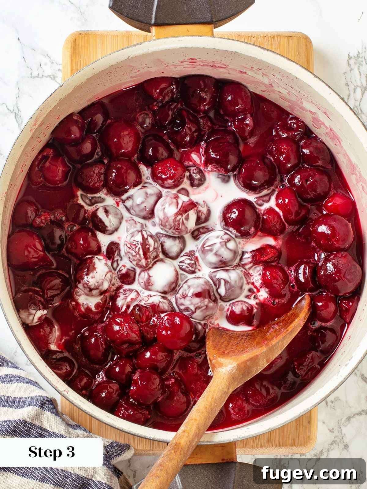 Homemade Cherry Pie Filling Perfection 6 Thickener (cornstarch slurry) added to saucepan of cherries to begin thickening the filling as it cooks on the stovetop.