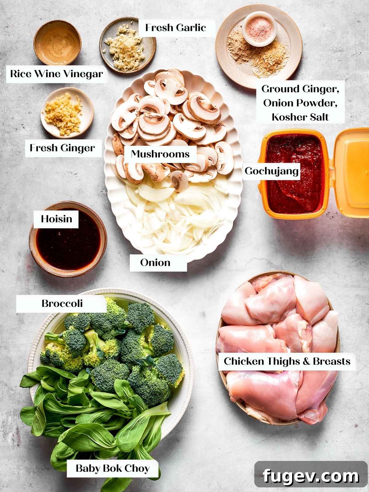Gochujang Glazed Chicken 3 Raw ingredients including chicken, bok choy, mushrooms, garlic, and gochujang laid out on counter.
