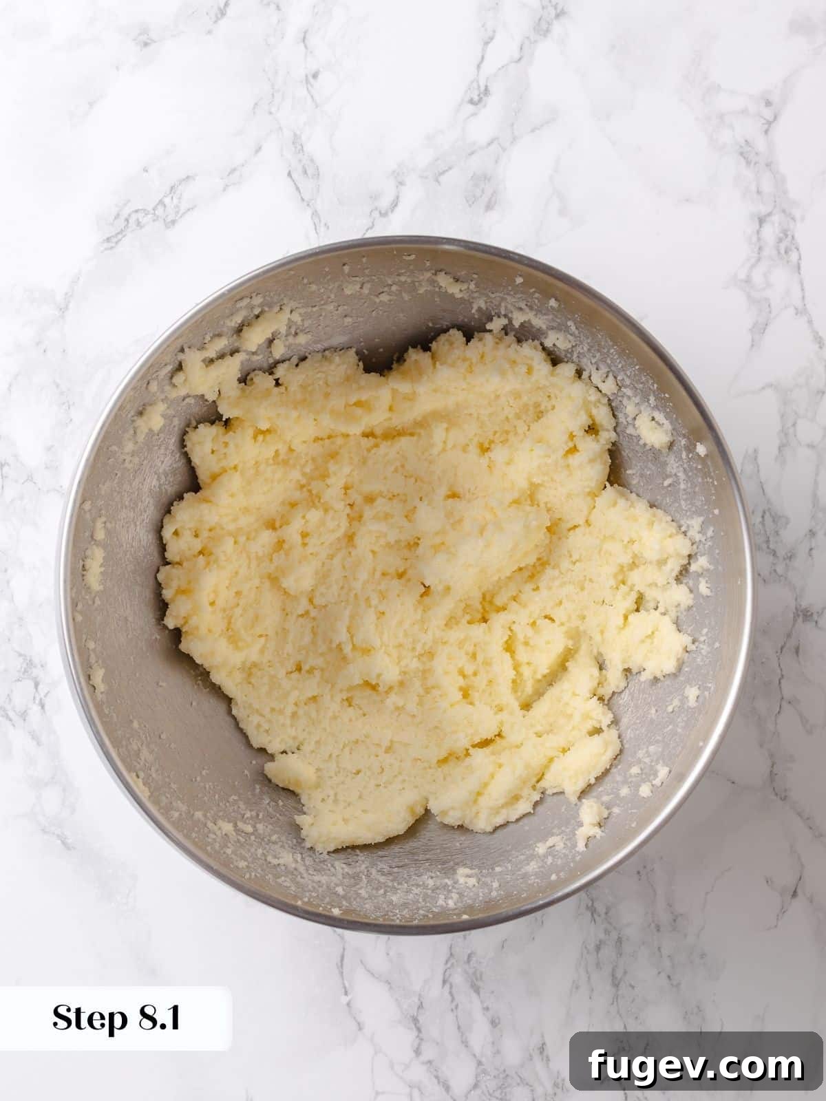Melted Butter Dream 13 Softened butter and sugar are creamed together in a mixer, establishing the rich, creamy foundation for the cake's topping.