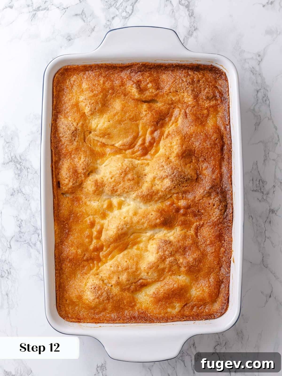 Melted Butter Dream 22 The finished gooey butter cake, perfectly baked to a golden brown, featuring puffed edges and a soft, yielding center.