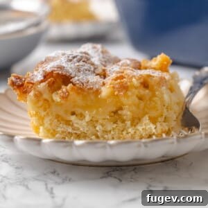 Center of gooey butter cake shown with buttery filling layered over the yeasted cake base, highlighting its delicious texture.