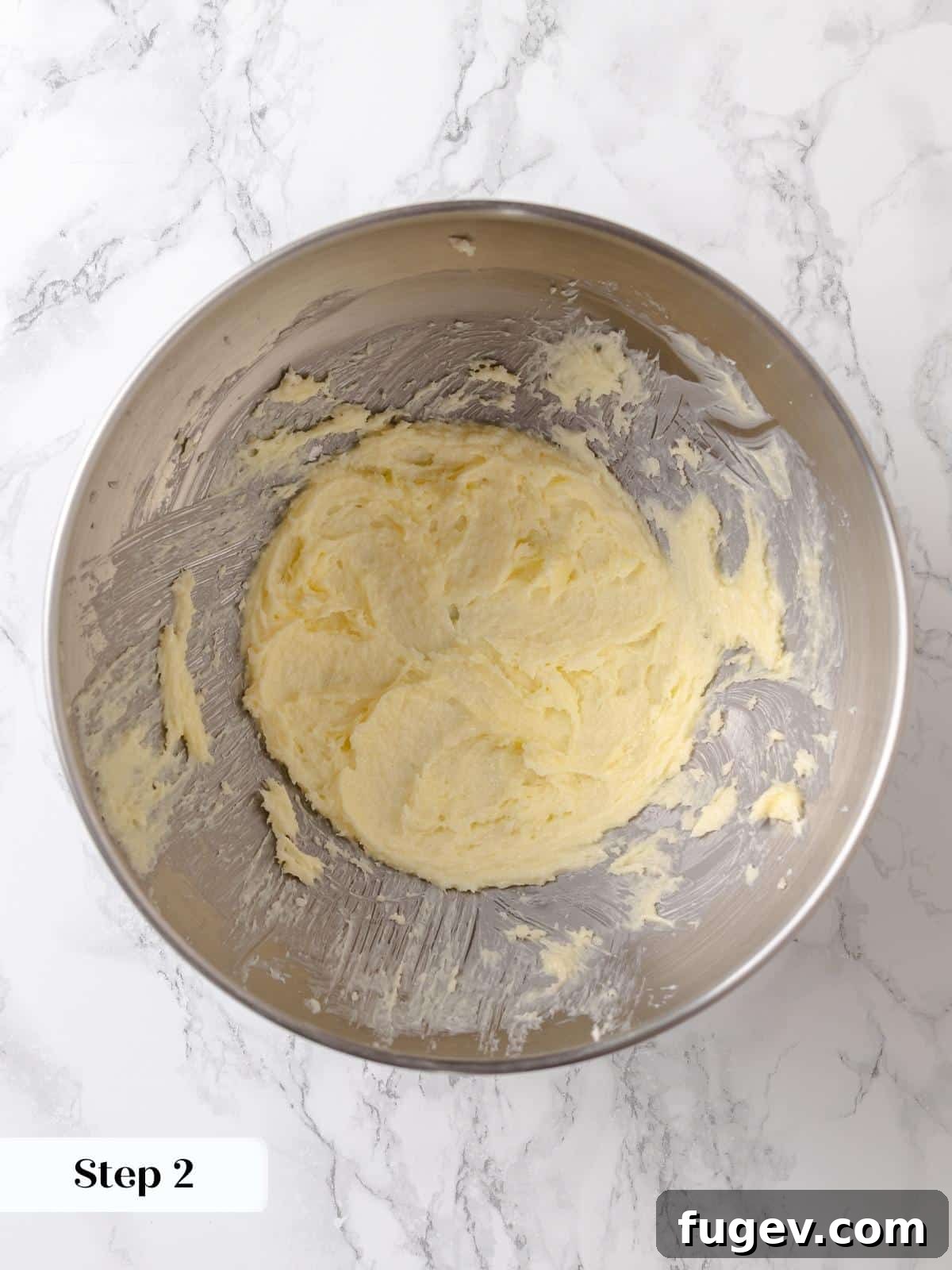 Melted Butter Dream 6 Butter and sugar mixture is creamed until lightened in color and texture, forming the first key step of the cake base.