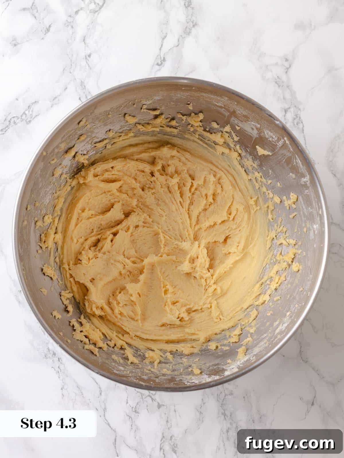 Melted Butter Dream 10 Smoothed dough is evenly spread in the pan, forming a consistent base before it rises and receives the topping.