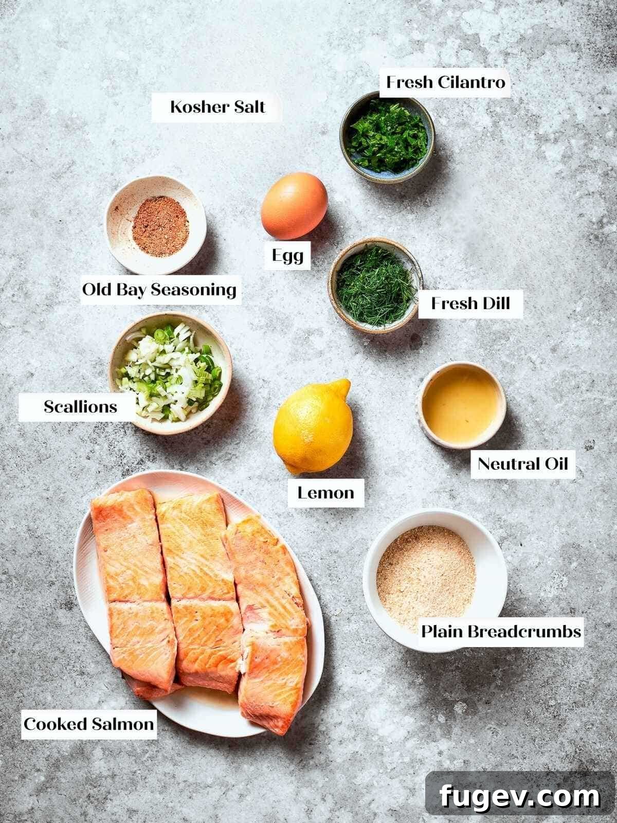 Gourmet Salmon Burgers 3 Prep station with ingredients like lemon, scallions, dill, and salmon for patty mixture.