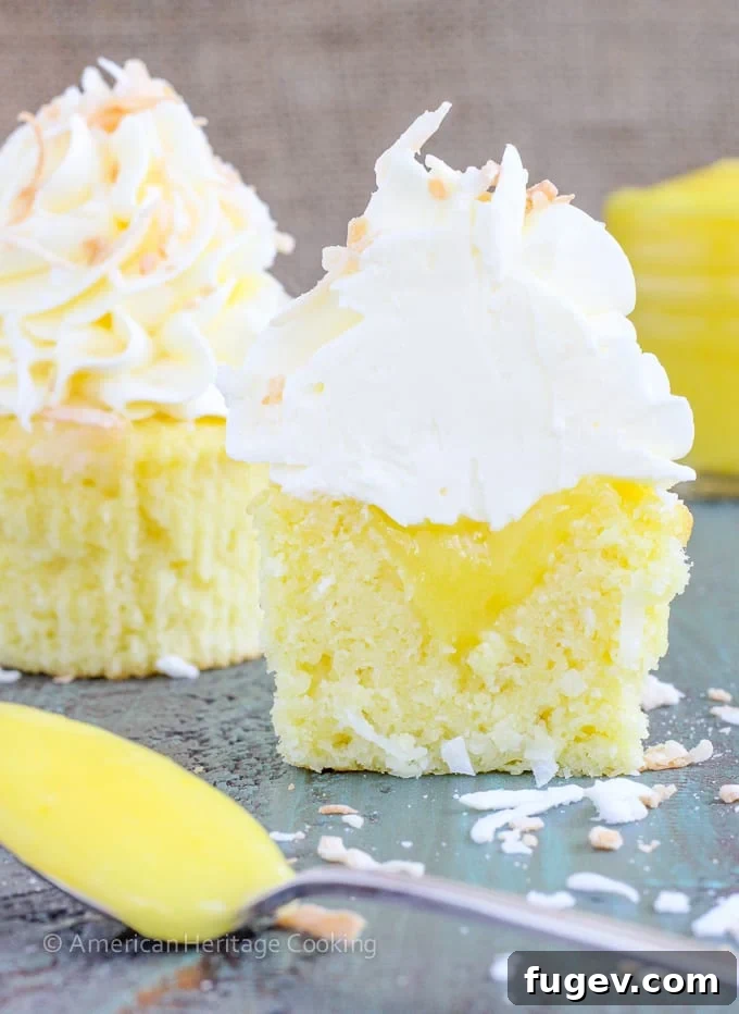 Tropical Lemon Coconut Cupcakes 2 These Lemon Coconut Cupcakes have a moist coconut cake, a sweet, tart lemon curd filling and are topped with a lemon Italian meringue buttercream!