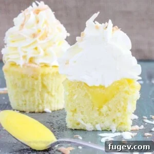 In these Lemon Coconut Cupcakes a moist coconut cupcake that is made with both dried coconut and coconut milk is filled with lemon curd and then topped with a coconut Italian Meringue Buttercream. And then topped off with some more toasted coconut.