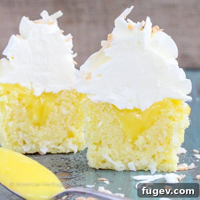 Tropical Lemon Coconut Cupcakes 7 In these Lemon Coconut Cupcakes a moist coconut cupcake that is made with both dried coconut and coconut milk is filled with lemon curd and then topped with a coconut Italian Meringue Buttercream. And then topped off with some more toasted coconut.