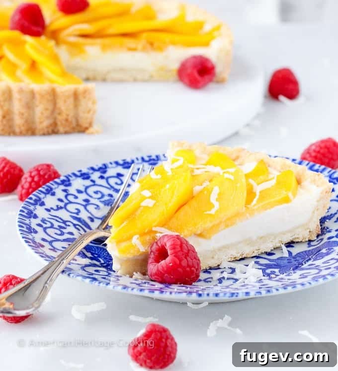 Tropical Mango Coconut Dream 3 Close-up of a Coconut Mango Tart, highlighting the vibrant fresh mango topping and creamy filling.