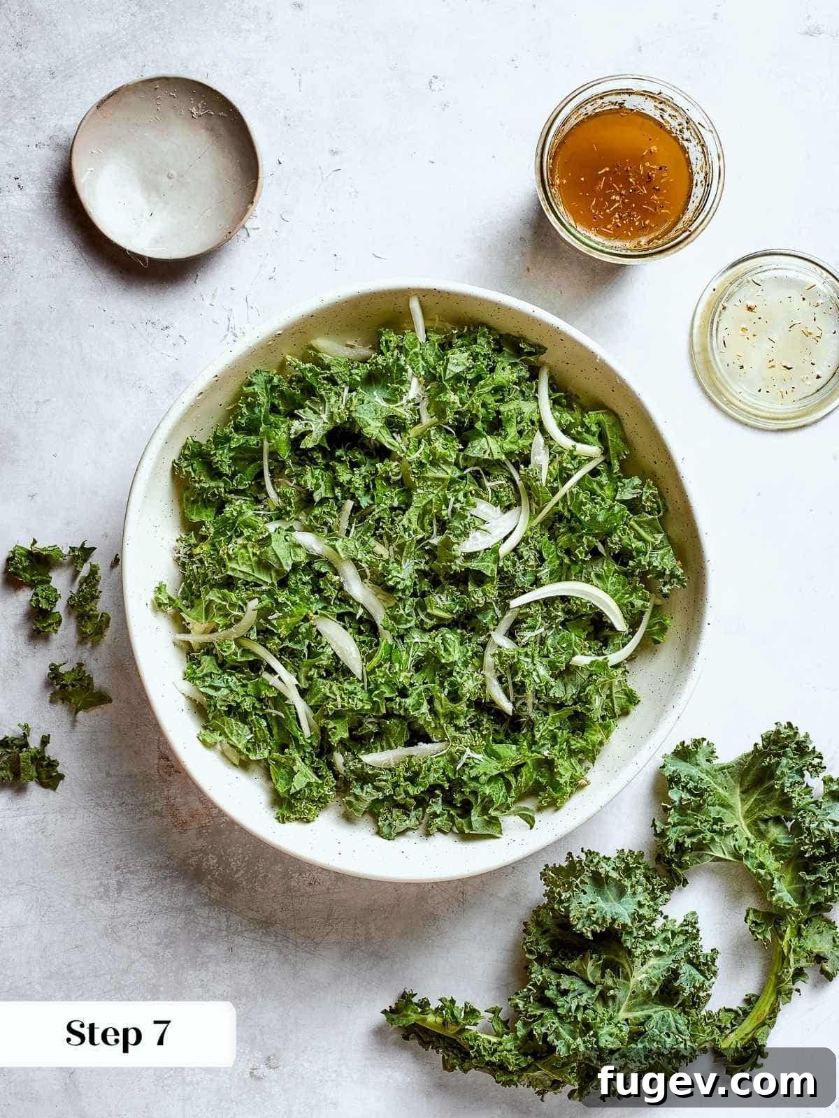 Vibrant Tuscan Kale Delight 11 Chopped kale and thin onion slices mixed for Tuscan kale salad, ready for dressing.