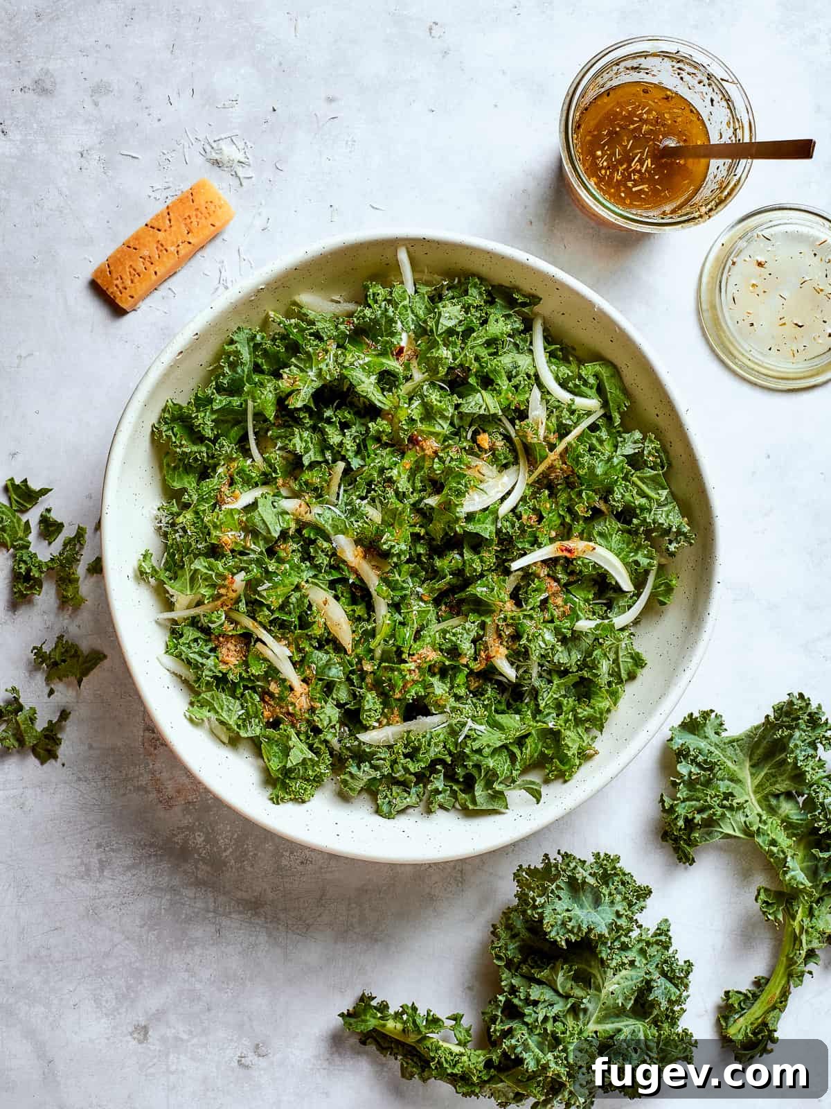 Vibrant Tuscan Kale Delight 14 Large serving bowl filled with Tuscan kale salad, onions, parmesan, and breadcrumbs, ready to be enjoyed.